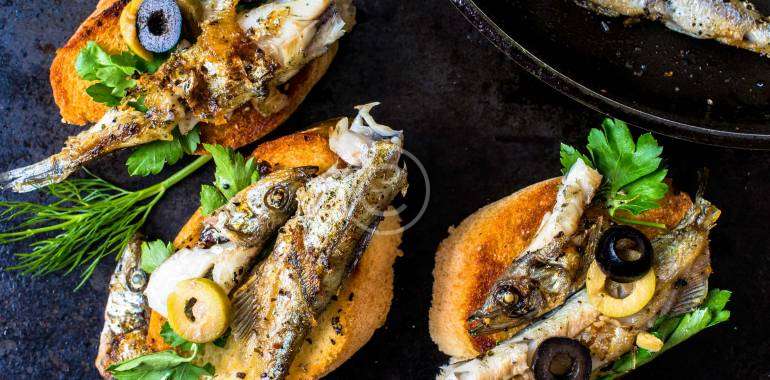 Sandwiches, tapas with grilled fish